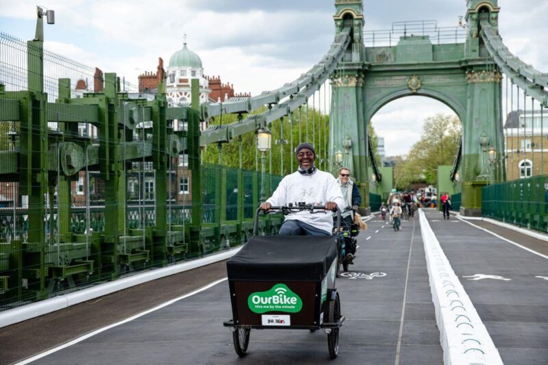 Cyclists and pedestrians using the newly open roadway on Hammersmith Bridge.
