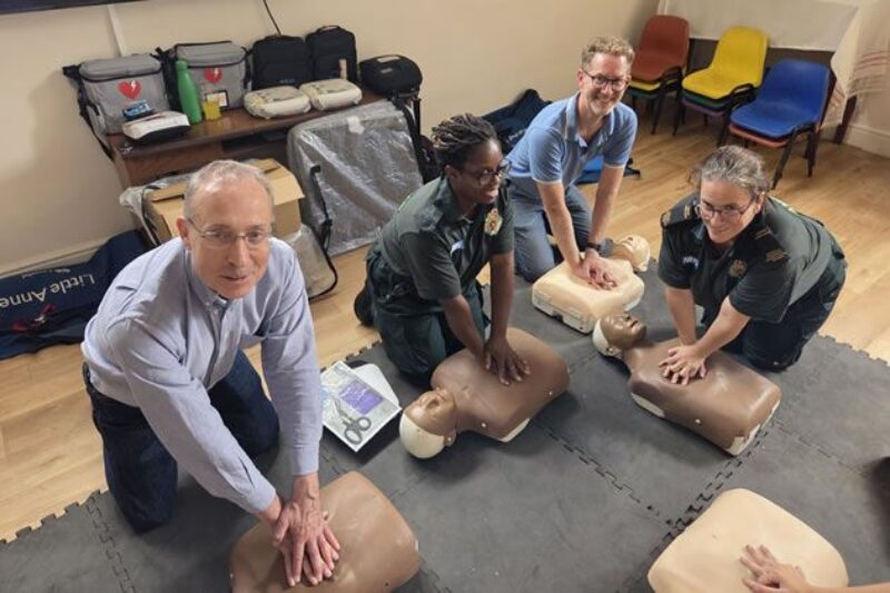 Learning CPR with staff from London Ambulance Service. 